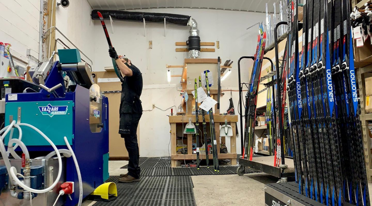 Service manager jeremy hecker waxes in the Pioneer Midwest service center